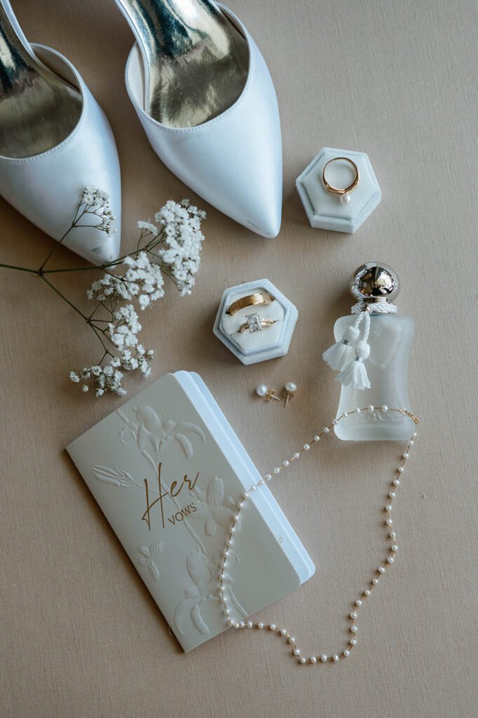 light blue jimmy choo brides' shoe and wedding ring and perfume